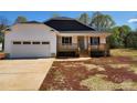 Charming single-story home with a covered front porch and an attached two-car garage on a spacious lot at 4168 S Olivers Cross Rd # 6, Newton, NC 28658
