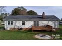 Exterior features a wooden deck, siding, and a fire pit at 507 Texas Trl, Dallas, NC 28034