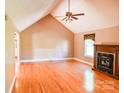 Spacious living room boasts wood floors, fireplace, and ample natural light with high ceilings at 6779 Highway 557 Hwy, Clover, SC 29710