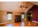 Spacious living room featuring a fireplace and a ceiling fan for added comfort at 6779 Highway 557 Hwy, Clover, SC 29710