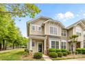 Charming two-story home featuring stone accents and manicured landscaping at 1001 Woodglen Ln, Matthews, NC 28104