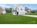 Beautiful two-story home featuring a well-manicured lawn and attached two car garage at 1041 Secor St, Statesville, NC 28677
