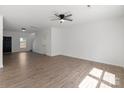 Open living space featuring hardwood floors and a modern ceiling fan at 1041 Secor St, Statesville, NC 28677