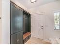 Stylish entryway with built-in storage and bench seating, offering a practical and welcoming space at 1124 Culver Spring Way, Charlotte, NC 28215