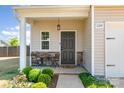 Inviting front porch with decorative stone accents and a cozy seating area, perfect for enjoying the outdoors at 1124 Culver Spring Way, Charlotte, NC 28215