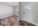 Inviting foyer features stylish floors and a bright front door at 113 Fosters Glen Pl, Mooresville, NC 28115