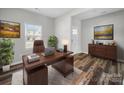 Bright home office featuring a modern desk and ample natural light at 113 Fosters Glen Pl, Mooresville, NC 28115