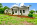 Cozy bungalow home featuring a covered porch and refreshed curb appeal at 113 Woodside Ave, Gastonia, NC 28054
