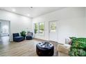 Bright living room featuring light-colored walls, hardwood flooring, and natural light at 113 Woodside Ave, Gastonia, NC 28054