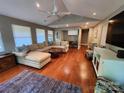 Bright living room with hardwood floors, vaulted ceiling, neutral colors, with lots of natural light at 148 Palaside Ne Dr, Concord, NC 28025