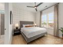 Inviting bedroom with a large window, neutral decor, and a comfortable queen-size bed at 16004 Tulloch Rd, Charlotte, NC 28278