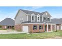 Beautiful home features a two-car garage, brick and siding exterior, and a well-maintained lawn at 1701 30Th Avenue Ne Ct, Hickory, NC 28601