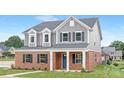 Charming two-story home with brick and gray siding, complemented by a well-manicured lawn at 1701 30Th Avenue Ne Ct, Hickory, NC 28601