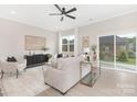 Bright living room with neutral tones, modern furniture, and natural light from sliding glass doors at 1701 30Th Avenue Ne Ct, Hickory, NC 28601