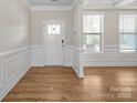 Light and bright foyer with wood floors and traditional trim at 3042 Burnello Ct, Iron Station, NC 28080