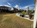 Cozy patio area featuring outdoor seating, landscaping, and a partial view of the grassy backyard at 3042 Burnello Ct, Iron Station, NC 28080
