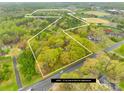 A sprawling 27-acre lot features wooded areas and expansive green spaces ready for development at 322 S Main St, Shelby, NC 28152