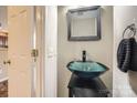 Stylish half bathroom with vessel sink, decorative mirror, and modern fixtures at 3420 Caldwell Ridge Pkwy, Charlotte, NC 28213