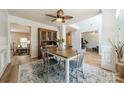 Formal dining room with stylish chairs and a view into the living areas at 3901 Parkers Fry None, Fort Mill, SC 29715