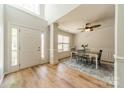 Bright foyer boasts hardwood floors, wainscotting detail, and views into the formal dining area at 3901 Parkers Fry None, Fort Mill, SC 29715