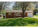 Charming brick home with a one-car garage and well-maintained front lawn at 501 8Th Sw Ave, Conover, NC 28613