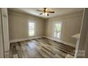 Bright bedroom featuring wood-look flooring and large windows allowing for natural light at 510 S Yadkin Ave, Spencer, NC 28159