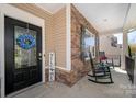 Welcoming front entrance with a blue wreath and 'Welcome' sign, complemented by stone detailing at 6061 Piscataway Ct, Rock Hill, SC 29732