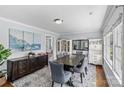 Formal dining room with elegant furnishings, including a large wooden table, upholstered chairs, and decorative accents at 6127 Rosecrest Dr, Charlotte, NC 28210