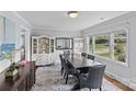 Tastefully decorated dining area with ample natural light, showcases a blend of modern and traditional design elements at 6127 Rosecrest Dr, Charlotte, NC 28210