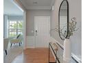 Elegant foyer with light wood floors, neutral walls, and stylish decor at 804 Birdsong Way, Fort Mill, SC 29715