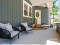 Inviting covered patio with comfortable seating, ideal for relaxing outdoors at 912 Westside Dr, Newton, NC 28658