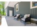View of outdoor patio featuring two chairs with cushions, great for relaxing outdoors at 912 Westside Dr, Newton, NC 28658