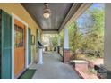 Inviting covered front porch with detailed trim and ample seating area at 1000 E 35Th St, Charlotte, NC 28205