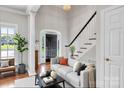 Inviting living room features a neutral color palette and staircase at 105 Snead Ct, Salisbury, NC 28144