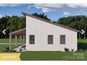 Modern farmhouse showcasing clean lines, sleek roof, inviting covered patio area, and lush green lawn at 180 Nc 742 Hwy, Wadesboro, NC 28170