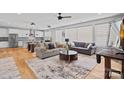 Spacious living area with an open floor plan that showcases the modern kitchen and comfortable seating at 310 Wesley Heights Way, Charlotte, NC 28208