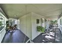 Inviting covered front porch with ample seating and serene views, perfect for relaxing outdoors at 4 Hummingbird Ct, Clover, SC 29710