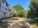 The property lot features partial construction and tree coverage under a clear, blue sky at 4105 Walker Rd, Charlotte, NC 28211