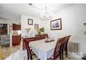 Elegant dining room showcasing a chandelier, wood table, and decorative accents at 4816 Spring Lake Dr # B, Charlotte, NC 28212