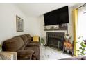 Inviting living room with a fireplace, TV, and stylish decor that complement the cozy atmosphere at 4816 Spring Lake Dr # B, Charlotte, NC 28212