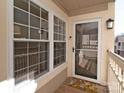 Inviting front porch featuring a storm door, large window, and charming welcome mat for a cozy entrance at 5007 Sharon Rd # R, Charlotte, NC 28210