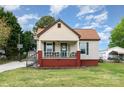 Charming single-story home featuring a welcoming front porch and a well-maintained lawn at 557 Hunter Ave, Kannapolis, NC 28083