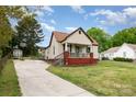 Cozy single-Gathering home with a long drive, quaint porch, and neatly kept front lawn at 557 Hunter Ave, Kannapolis, NC 28083