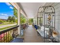 Inviting covered front porch with comfortable seating and decorative elements, perfect for relaxation at 911 Earl St, Shelby, NC 28150