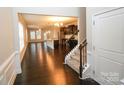 Open-concept living area with dark hardwood floors, modern fixtures, and abundant natural light at 1333 Rainier Dr, Fort Mill, SC 29708