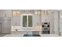 Modern kitchen featuring white cabinets, stainless steel appliances, marble countertops, and natural lighting at 1717 Brawley School Rd, Mooresville, NC 28117