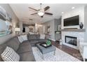 Comfortable living room features plush sectional sofa, fireplace, and open floorplan at 18832 Nautical Dr # 41, Cornelius, NC 28031