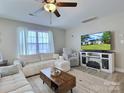 Cozy living room with large TV, comfortable seating, and ample natural light at 252 S Potter Rd, Lancaster, SC 29720