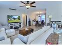 Bright living room featuring modern furnishings, wood floors and an open floor plan leading to the dining area at 252 S Potter Rd, Lancaster, SC 29720
