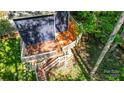 Elevated view of the wooden deck with stairs and railing surrounded by greenery at 4036 Windward Dr, Tega Cay, SC 29708